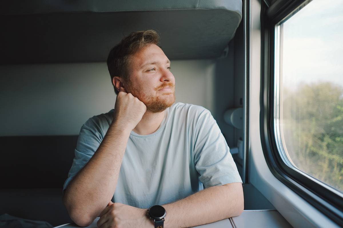 Someone to Talk To — Wherever You Are Man travelling on train